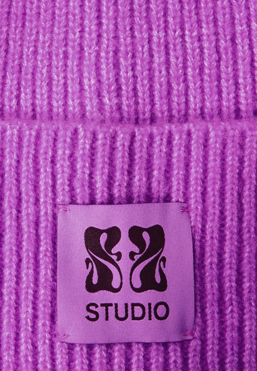 Beanie met badge
