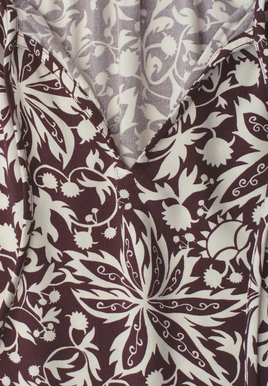 Blouse met hangende schouder en linten