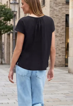 Blouse met hangende schouder en linten