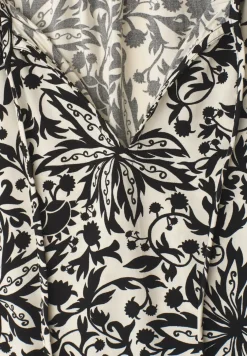 Blouse met hangende schouder en linten