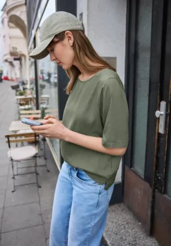 Blouse met korte mouwen en ronde hals in effen kleur