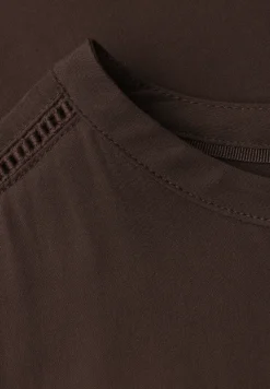 Blouse met overhangende schouders en getapete details