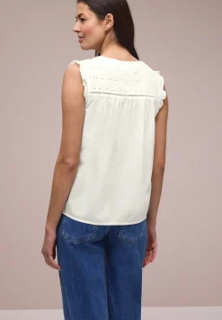 Blousetop met gespleten hals en shiffley-details