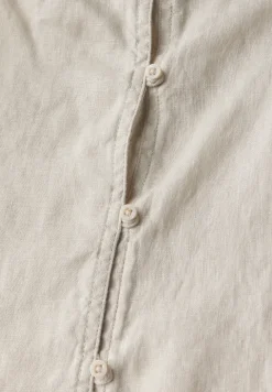 Blousetop met knoopdetail