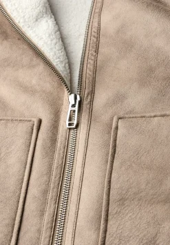 Jas met teddy details