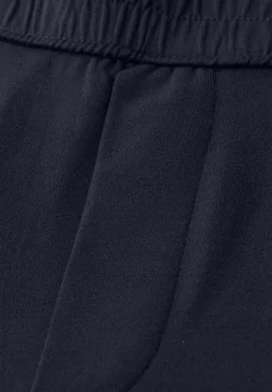 Mid Waist Slim Legs broek in Loose Fit