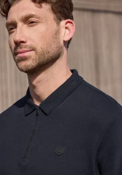 Poloshirt met rits en structuur