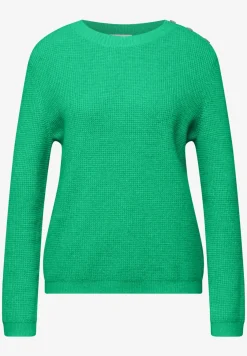 Trui met knoopdetail