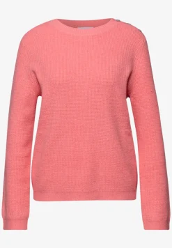 Trui met knoopdetail