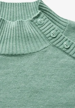 Trui met knoopdetail