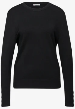 Trui met knoopdetail