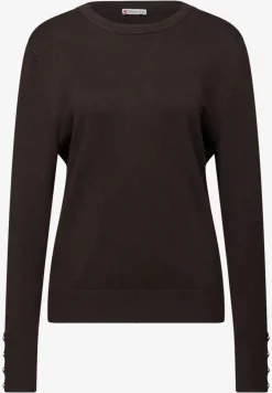 Trui met knoopdetail