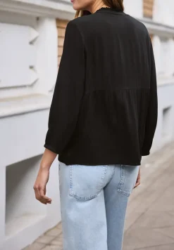 Tuniek met gespleten hals en borduursel