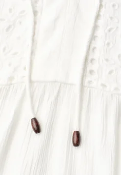 Tuniek met gespleten hals en borduursel