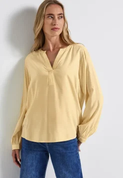 Tuniek met gespleten hals