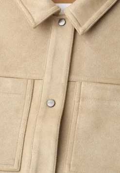 Velours jas met uitgesneden details